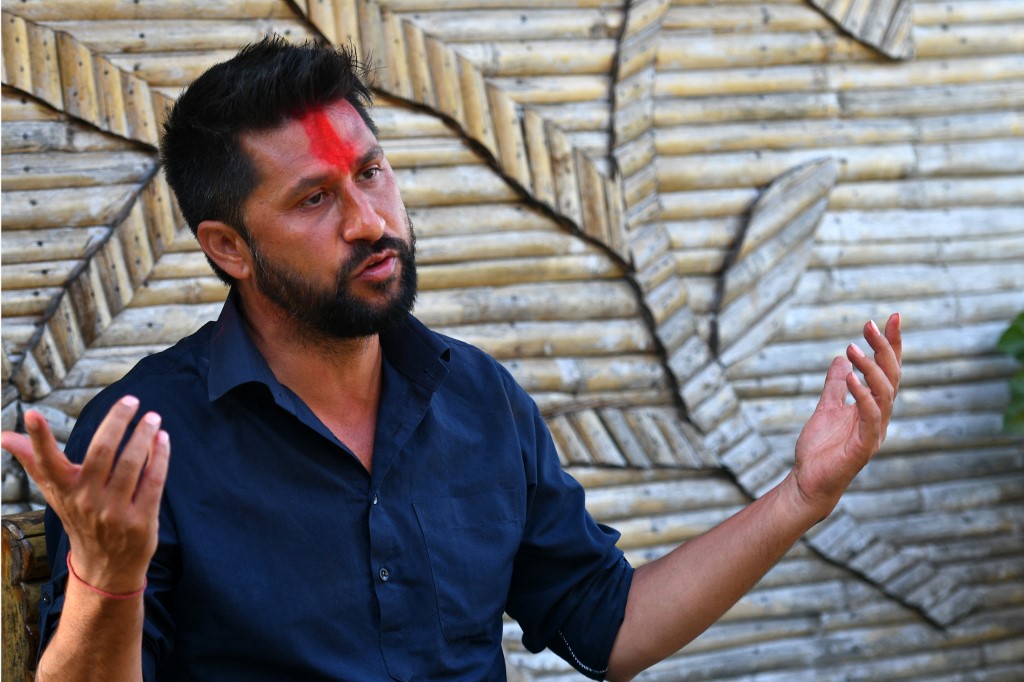 NEPAL-PARLIAMENT-VOTE Channel 13 cameraman tackled to ground by riot police Feb 19 protest.