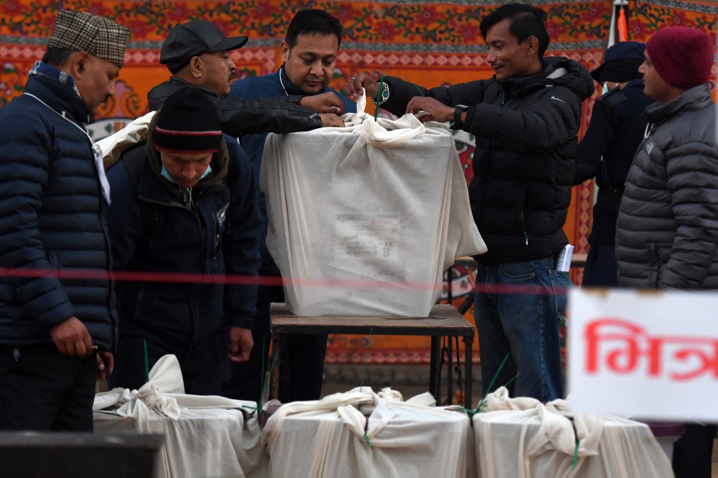 NEPAL-ELECTION-VOTE Channel 13 cameraman tackled to ground by riot police Feb 19 protest.