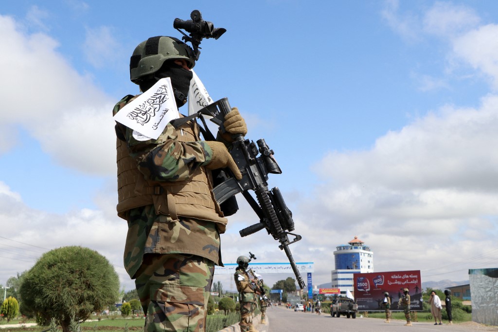 AFGHANISTAN-POLITICS-DEFENCE Channel 13 cameraman tackled to ground by riot police Feb 19 protest.