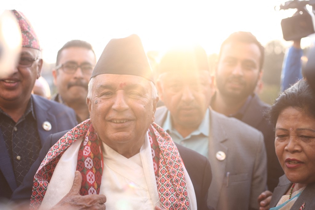 Ramchandra Paudel-President Elect Of Nepal Channel 13 cameraman tackled to ground by riot police Feb 19 protest.
