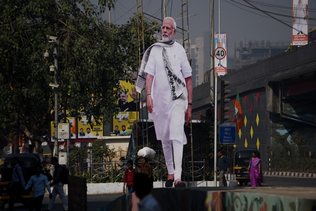 Cutouts Of Narendra Modi In Mumbai Channel 13 cameraman tackled to ground by riot police Feb 19 protest.
