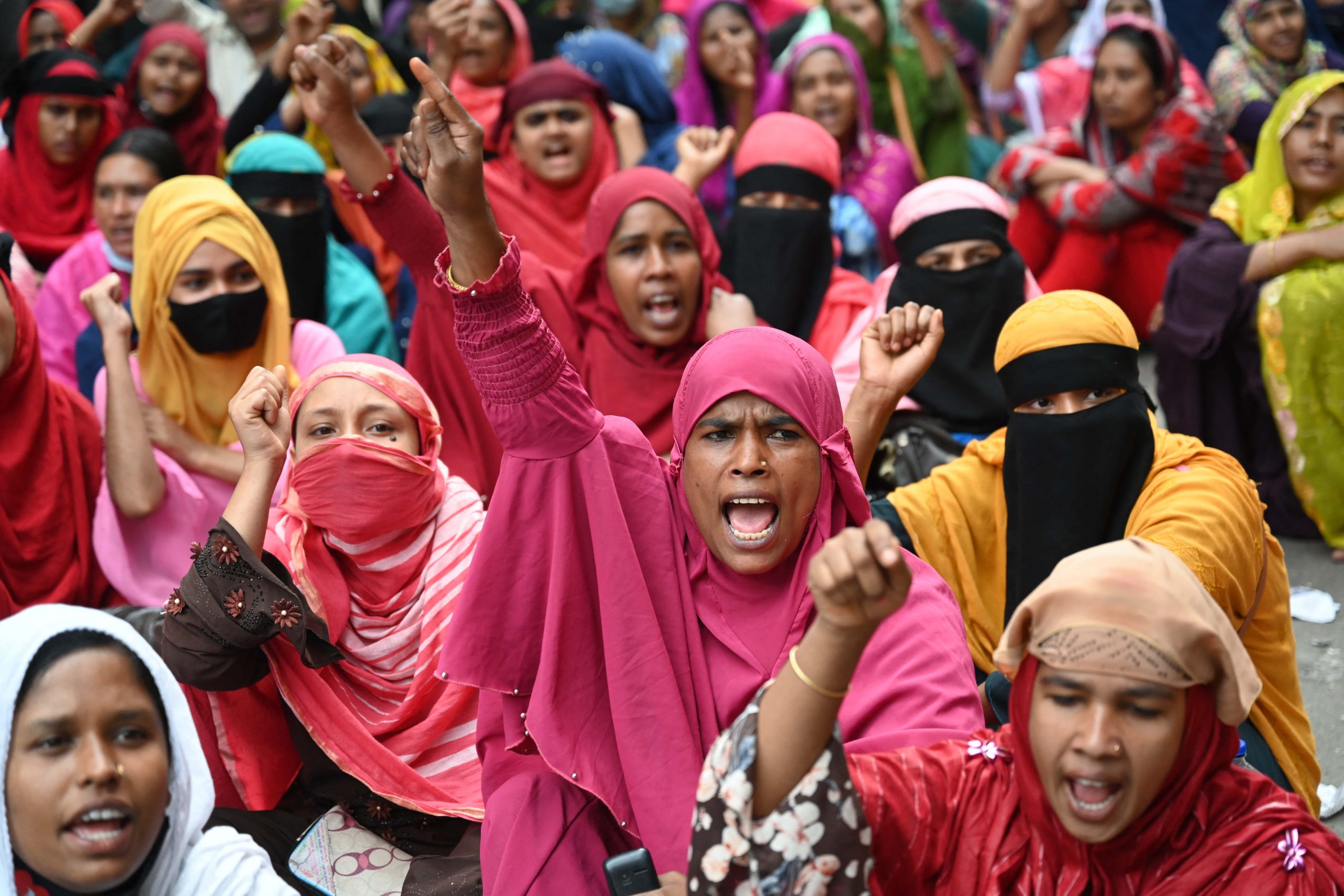 230227_npEHF garment worker women protest dhaka Mamunur Rashid NurPhoto-m Channel 13 cameraman tackled to ground by riot police Feb 19 protest.